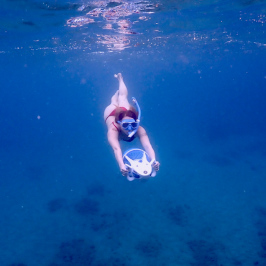 a man swimming in a body of water