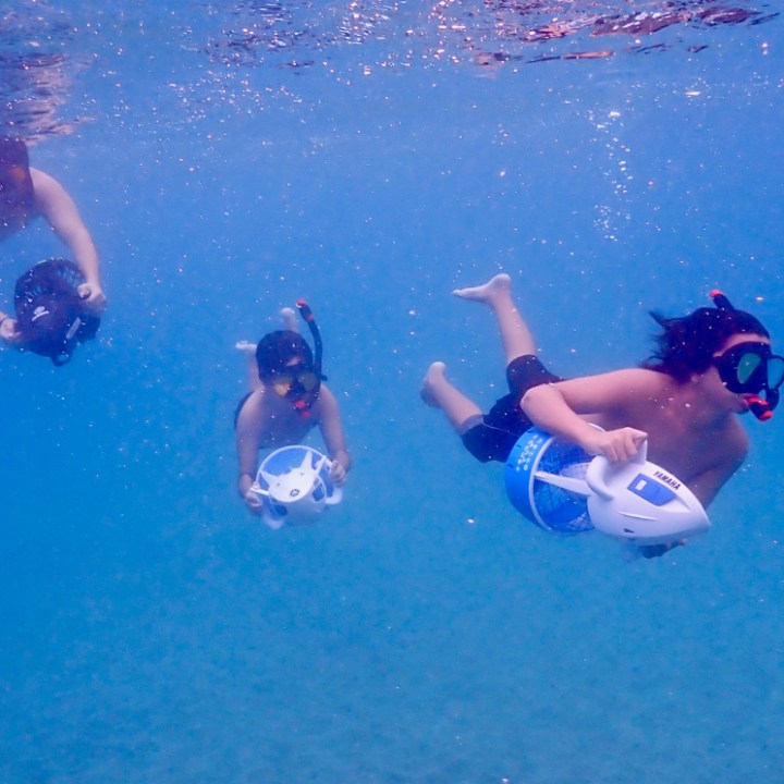 a man swimming in a pool of water