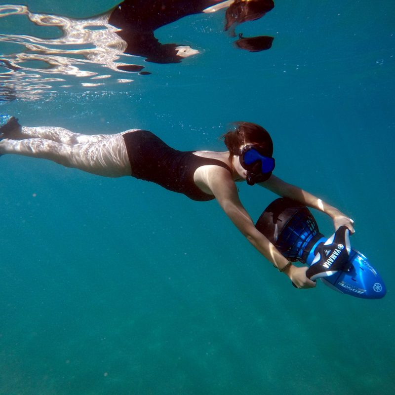 a man swimming in a pool of water