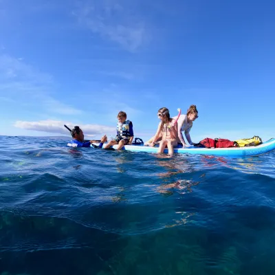 a man riding a wave on top of a body of water
