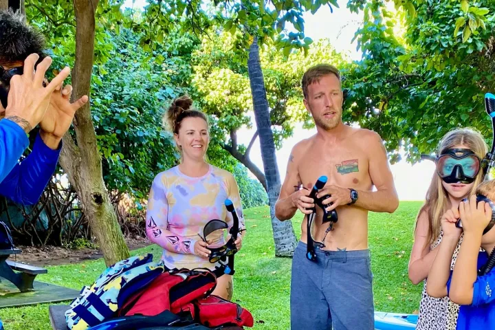 a couple of people that are standing in the grass